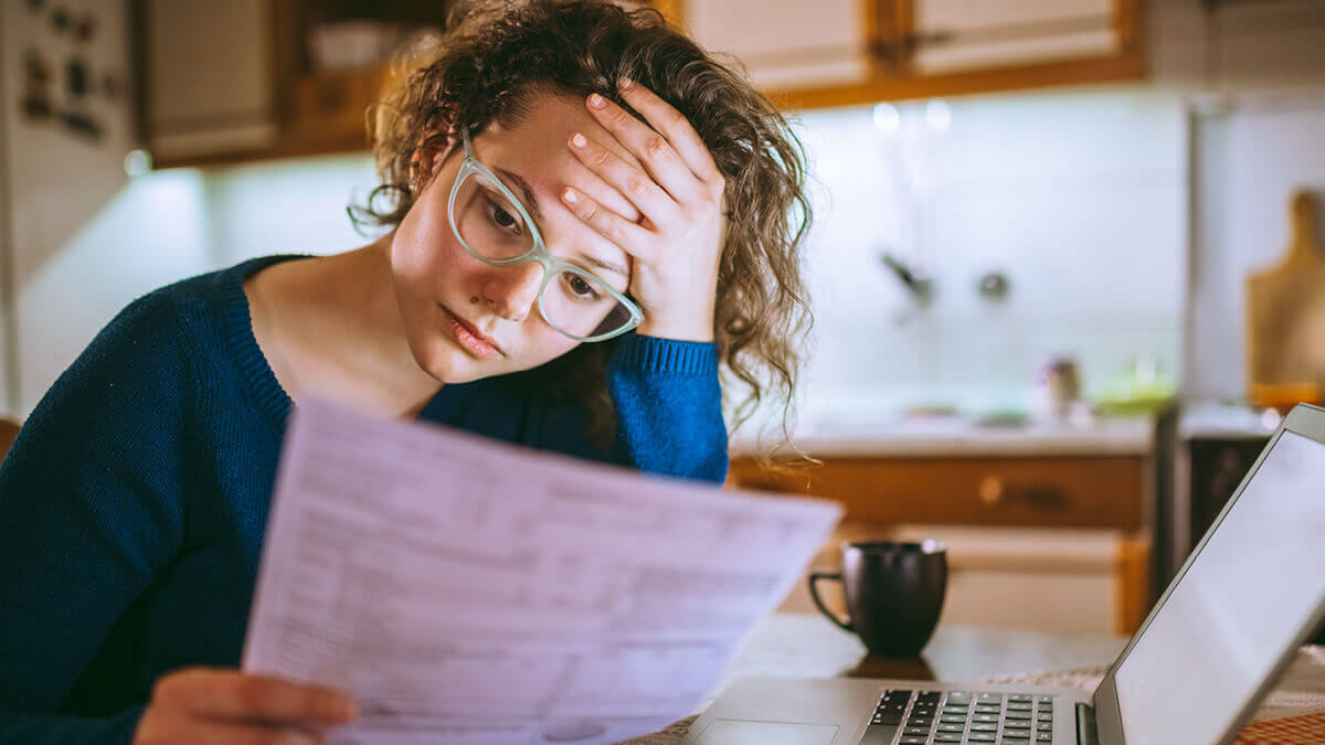 Person reading over a financial statement