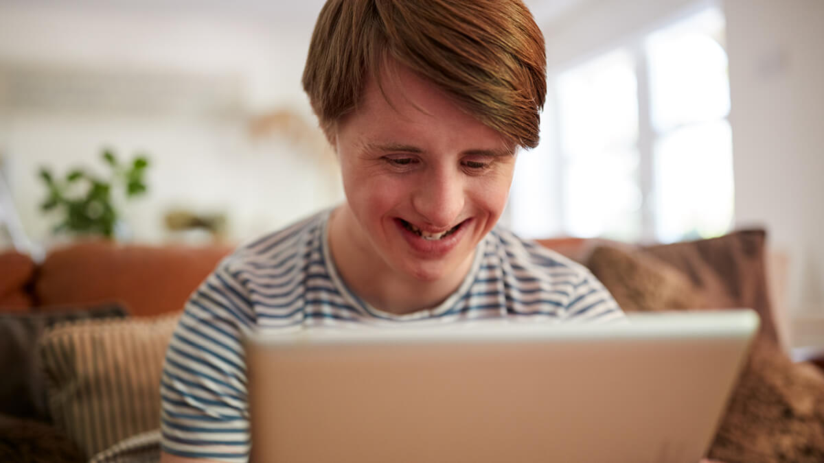 Smiling person on laptop