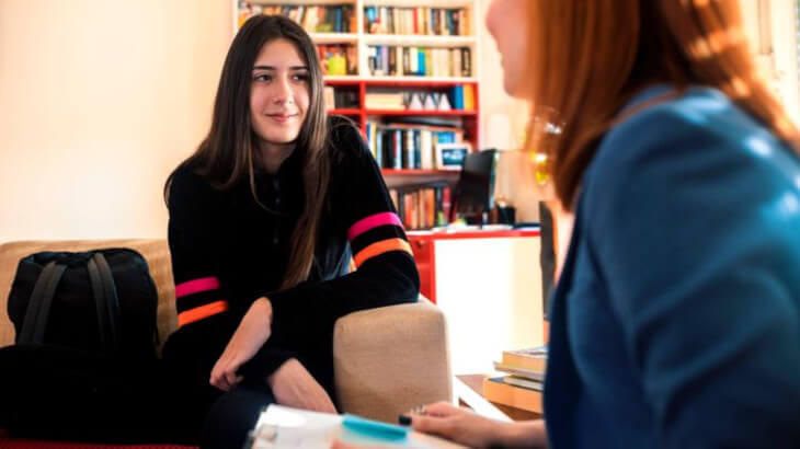 Two women talking in home environment