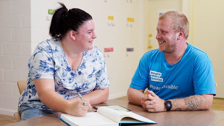 Job coach helping a woman with job planning