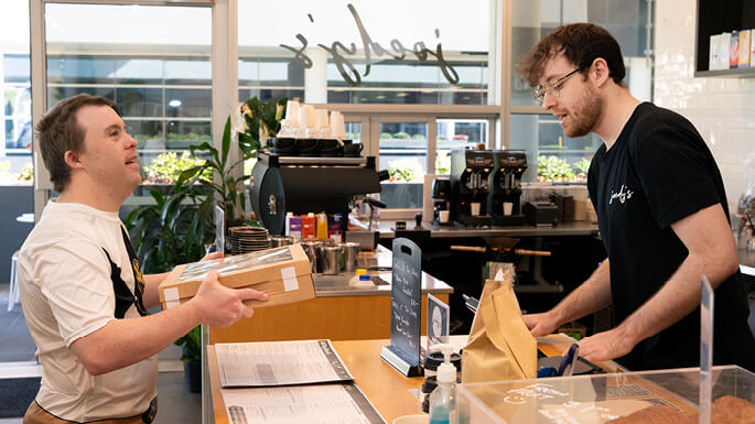 Two-men-interacting-at-cafejpeg