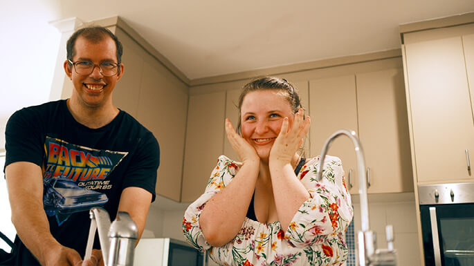 Two-people-smiling-in-kitchenjpeg