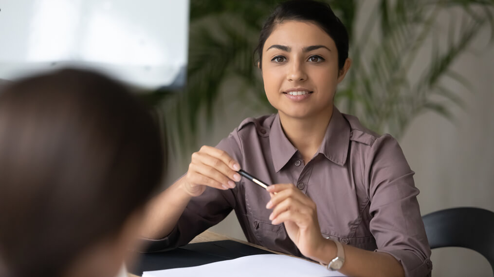 person-speaking-with-another-person-in-meeting.jpg
