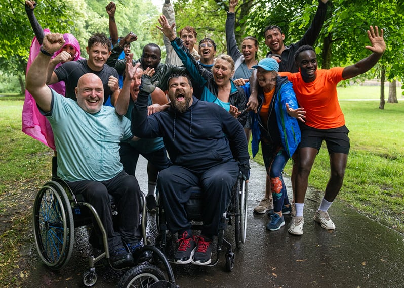 group-of-people-with-their-hands-up-in-celebration