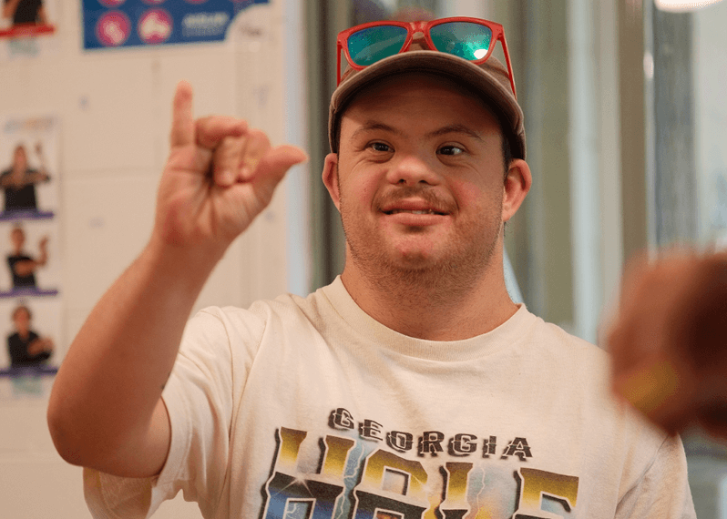 man-giving-a-sign-with-his-hand