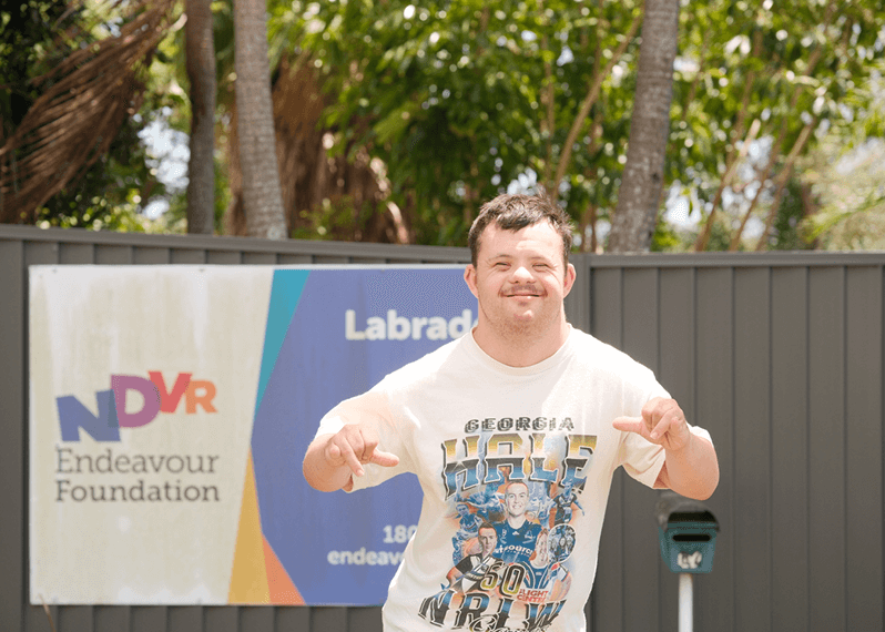 man-smiling-while-striking-a-pose-outside