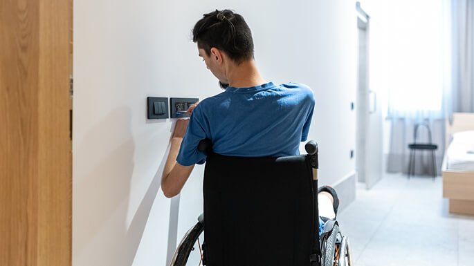 7_male-in-wheelchair-using-smart-technologyjpeg