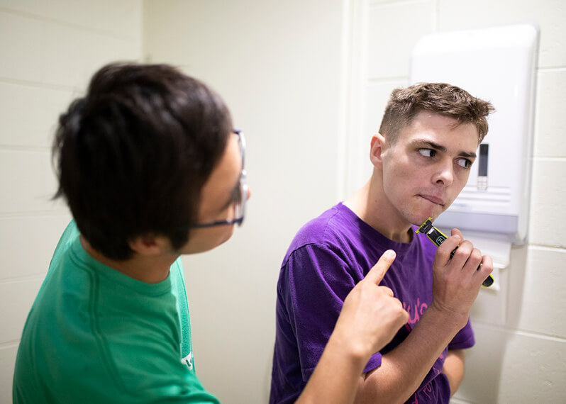 man-helping-another-man-shave.jpg