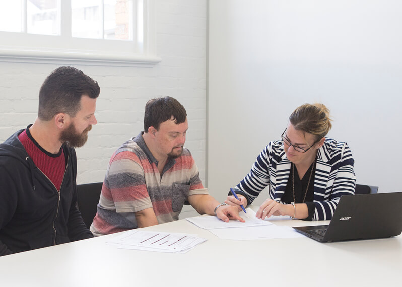 people-reading-over-paperwork.jpg