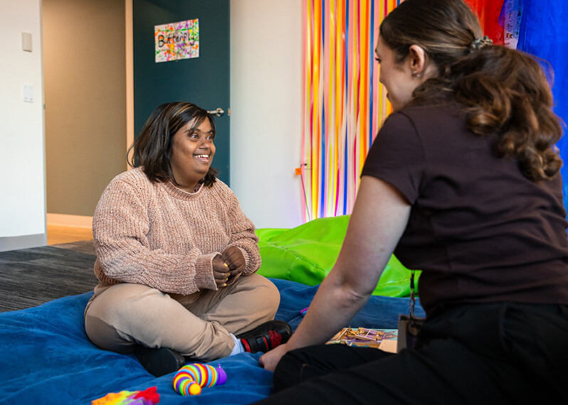 two-women-sitting-and-chatting.jpg