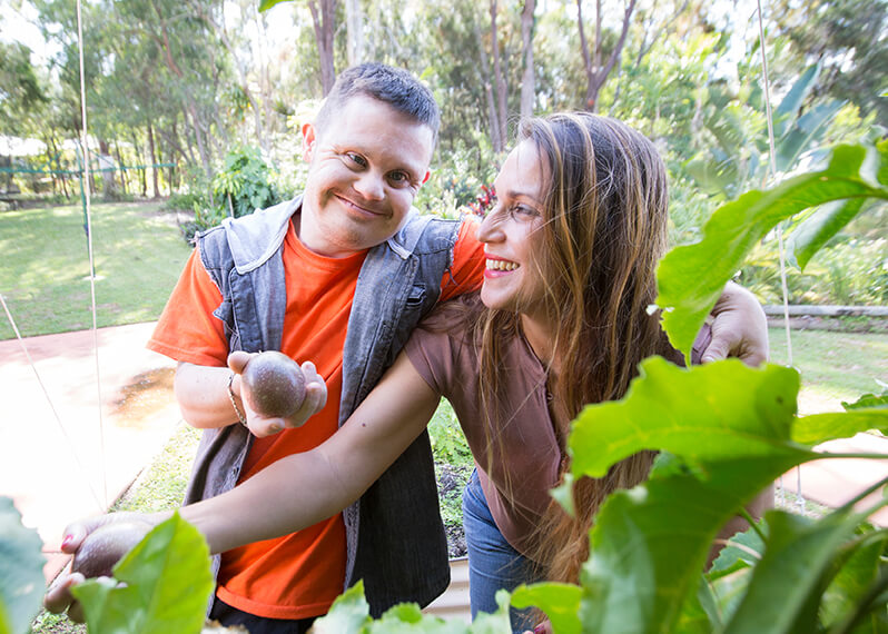 participant-and-support-worker-gardening-together.jpg