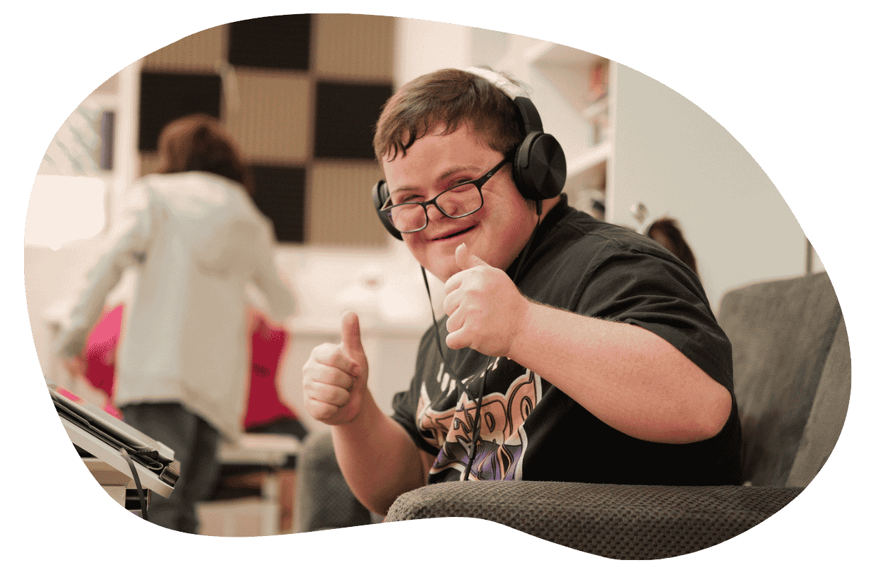 Young-happy-autistic-male-listening-to-music-