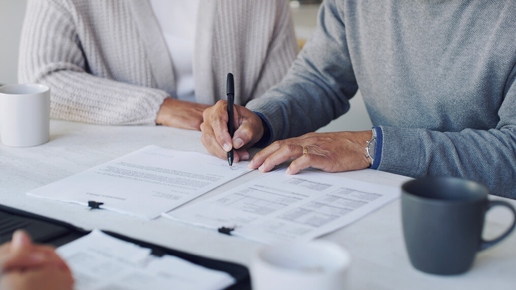 people-discussing-and-signing-documents.jpg
