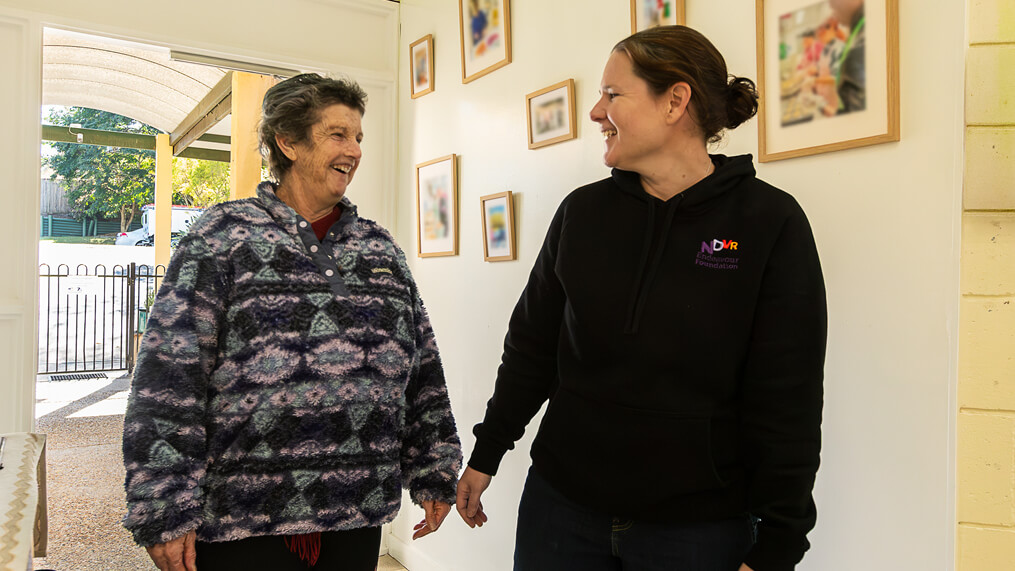 participant-and-support-worker-chatting-indoors.jpg