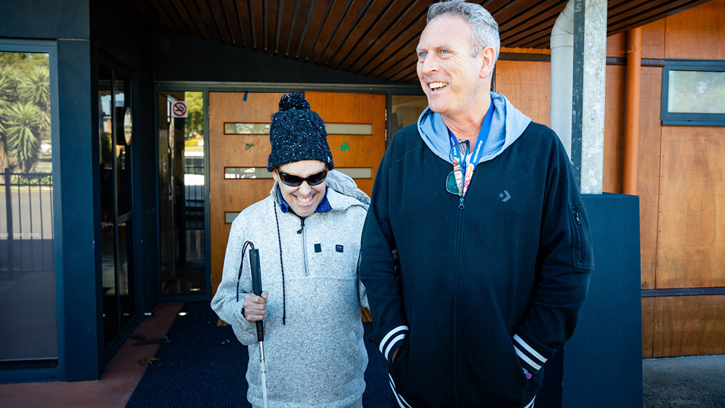 participant-and-support-worker-walking-outdoors.jpg
